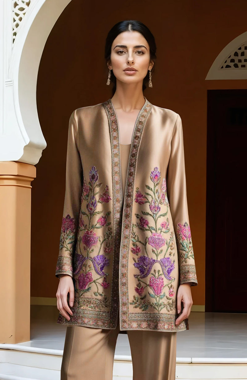 Beige jacket set with floral Kashidakari embroidery, satin camisole, and wide-leg trousers.