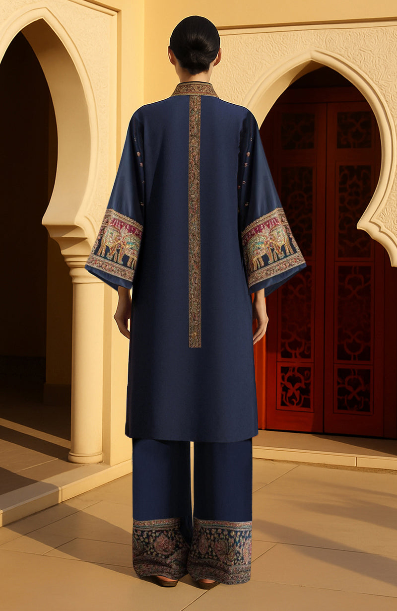 Midnight blue kimono jacket with gold, red, and green embroidered elephants and foliage details.