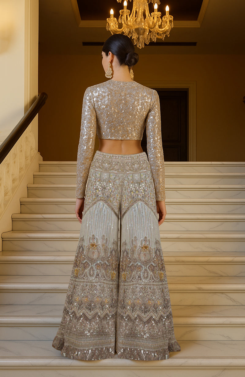 Silver and gold sequin high-neck crop top with embroidered sharara pants and ivory satin dupatta.