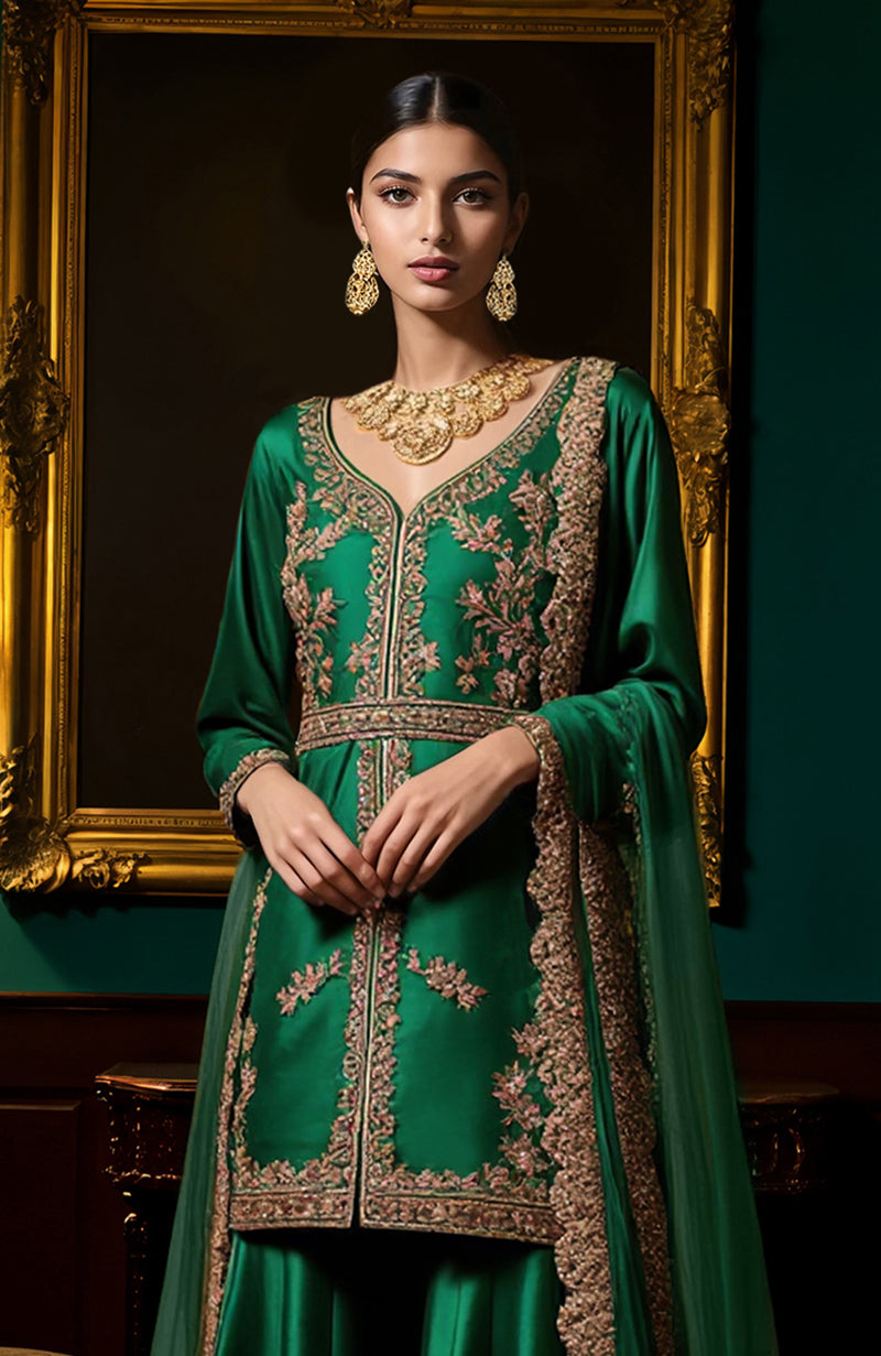 Emerald green sharara set with gold floral embroidery, structured jacket, wide pants, and sheer dupatta.