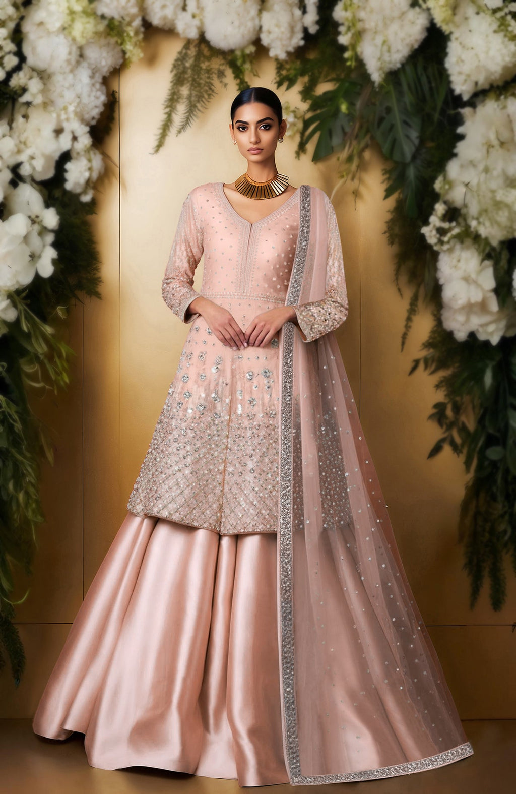 Ivory skirt set with bead and crystal embroidery, long jacket top, full sleeves, and sheer dupatta.