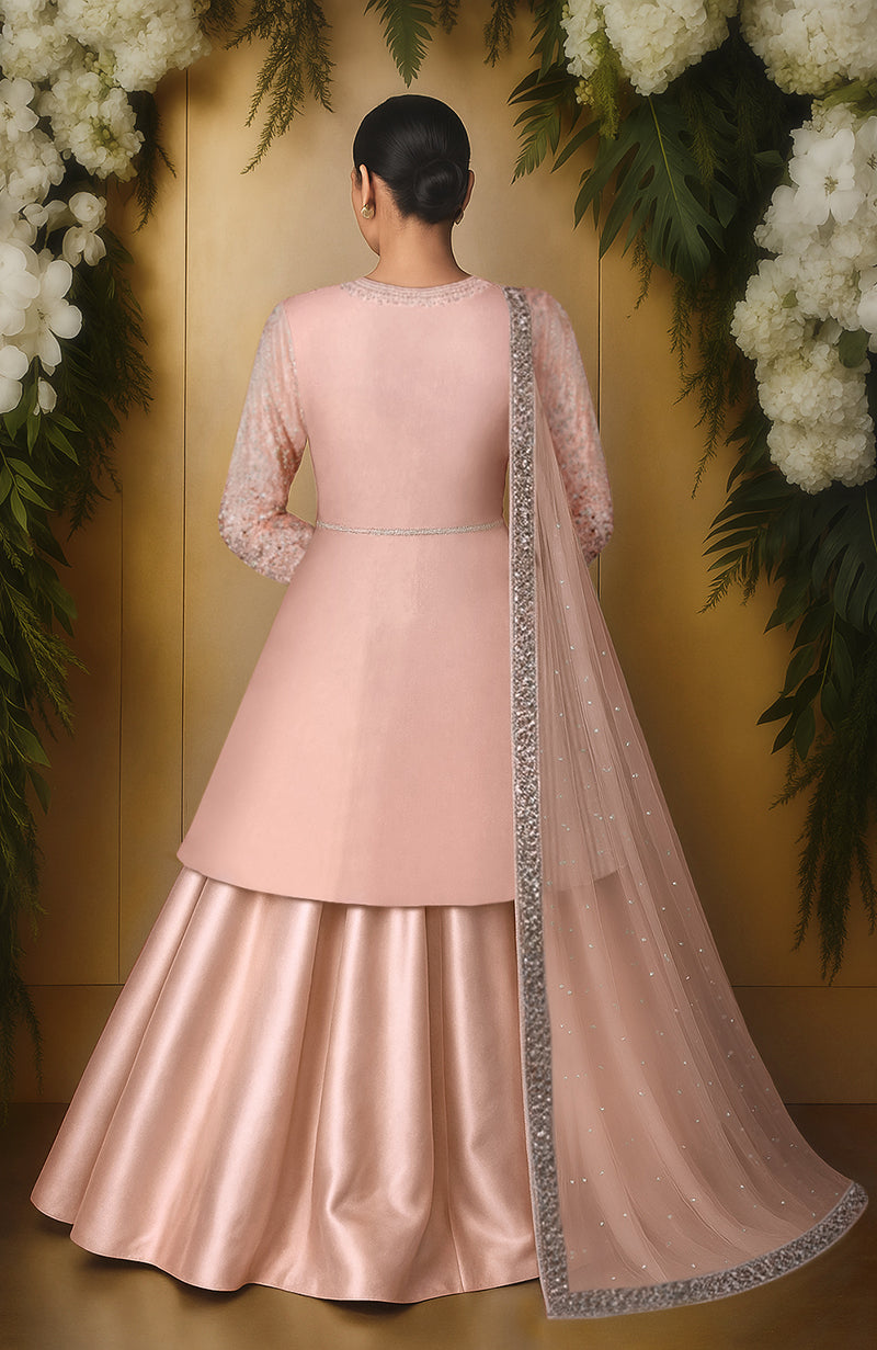Blush pink embroidered jacket and floor-length skirt with bead and crystal embellishments.