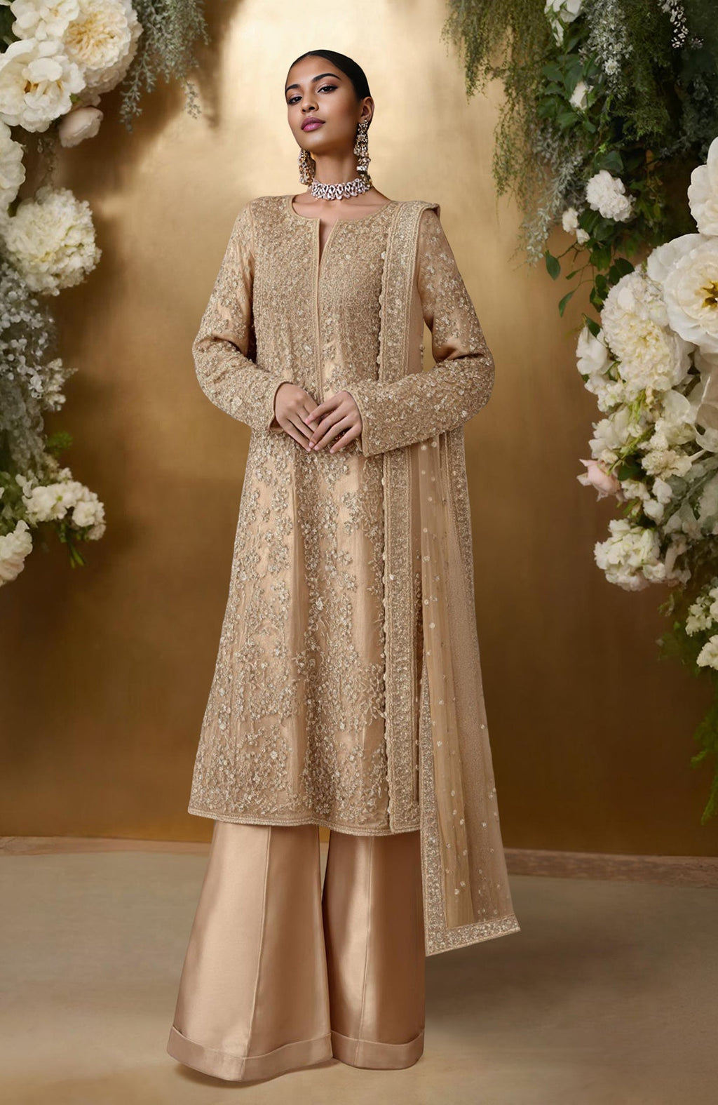 Champagne gold sharara set with bead and sequin embroidery, long kurta, wide-legged pants, and dupatta.