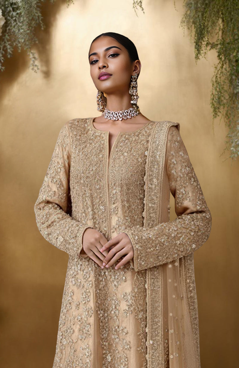 Champagne gold sharara set with bead and sequin embroidery, long kurta, wide-legged pants, and dupatta.