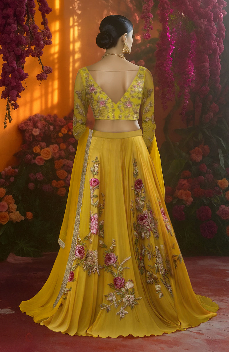 Marigold yellow lehenga set with floral embroidery, sheer long sleeves, and gold-bordered dupatta