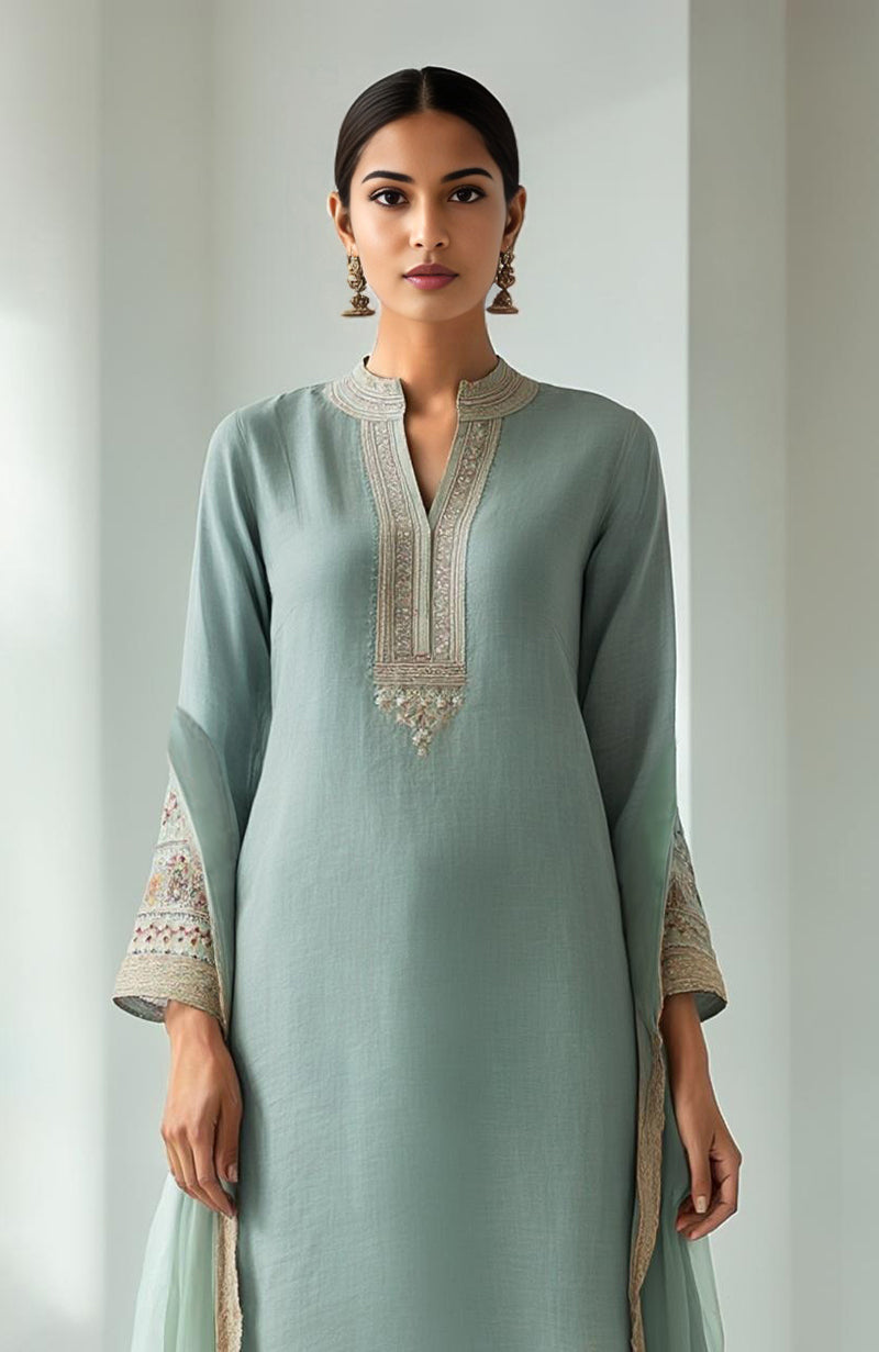 Eucalyptus green kurta set with floral embroidery, wide-leg trousers, and sheer organza dupatta.