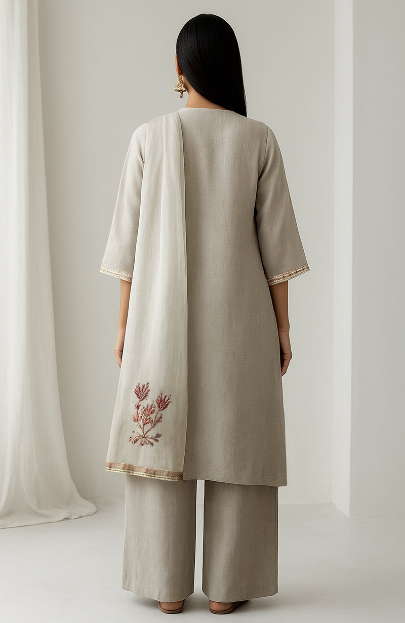 Ivory straight-cut kurta with embroidery, wide-leg trousers, and sheer organza dupatta with floral corners