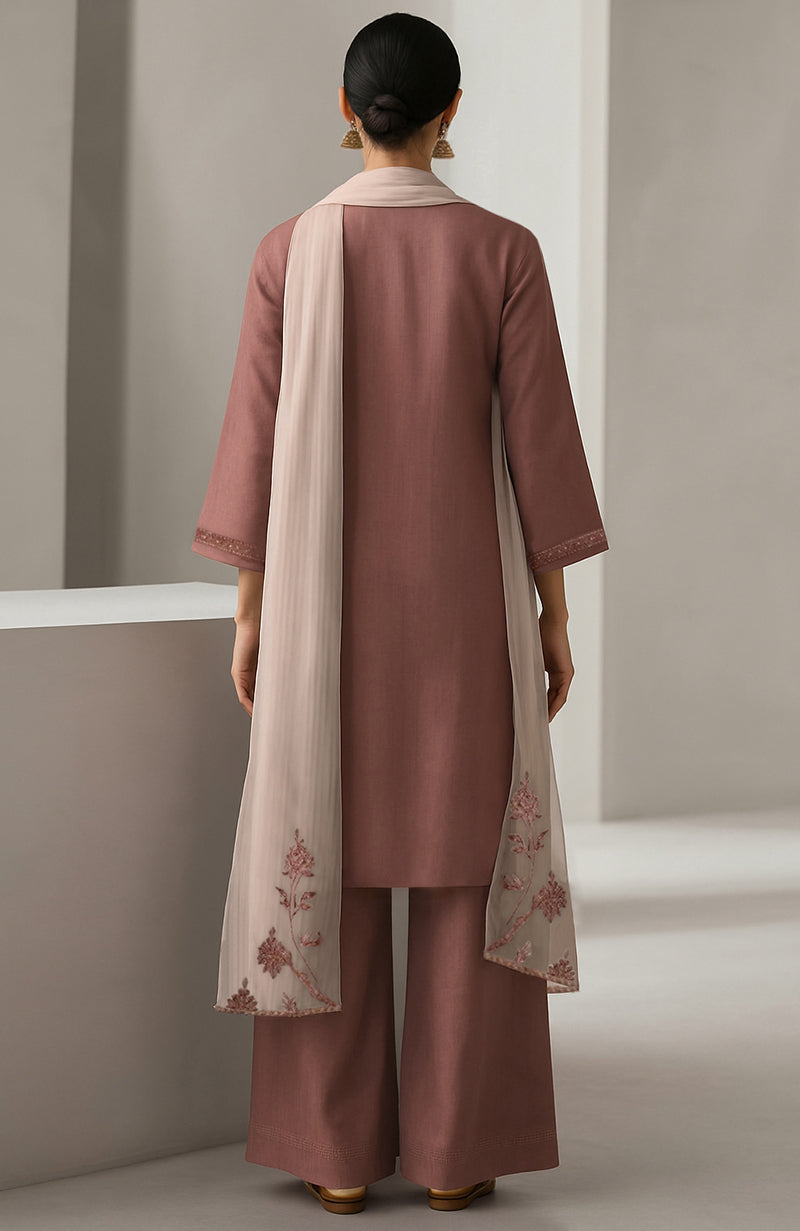 Muted rosewood straight kurta with embroidery paired with wide-leg trousers and sheer organza dupatta