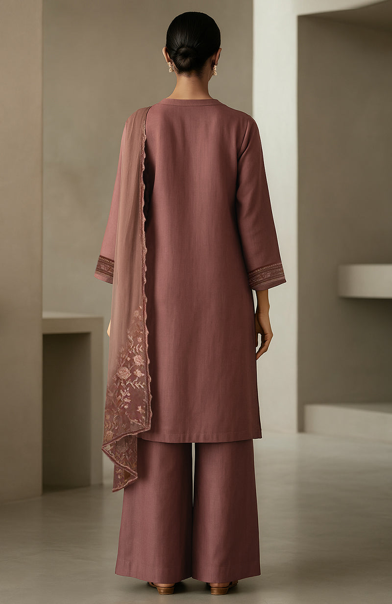 Muted rosewood straight kurta with embroidery, wide-leg trousers, and sheer embroidered dupatta.