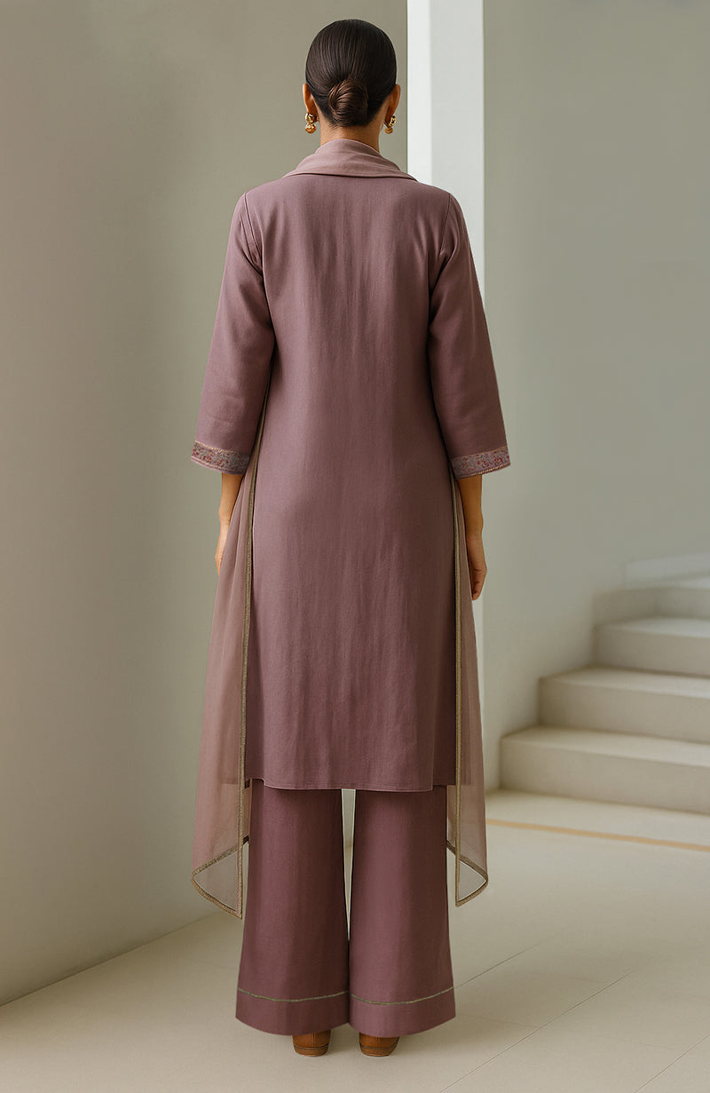 Dusty lilac straight kurta with embroidery, wide-leg trousers, and sheer organza dupatta.