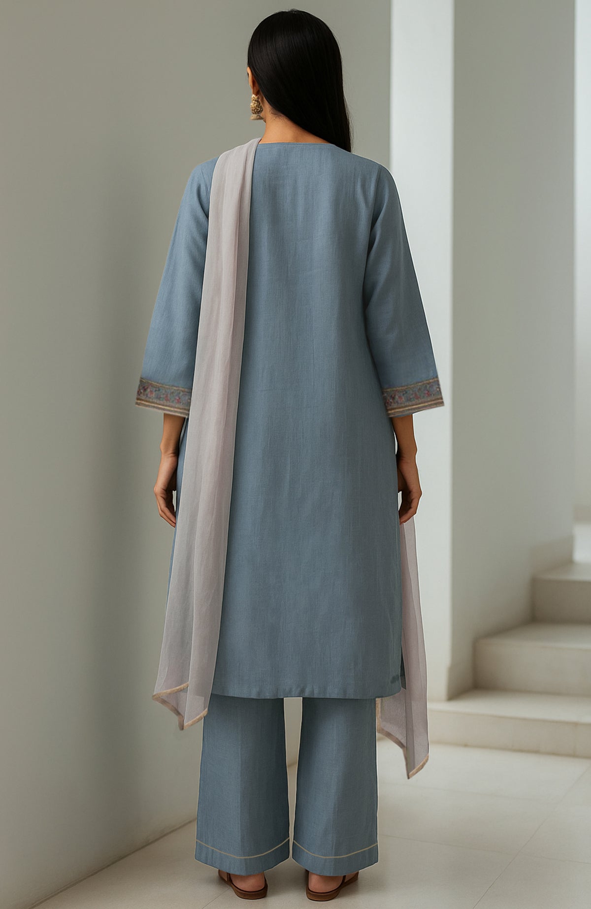 Powdered indigo straight kurta with embroidery, wide-leg trousers, and sheer organza dupatta.