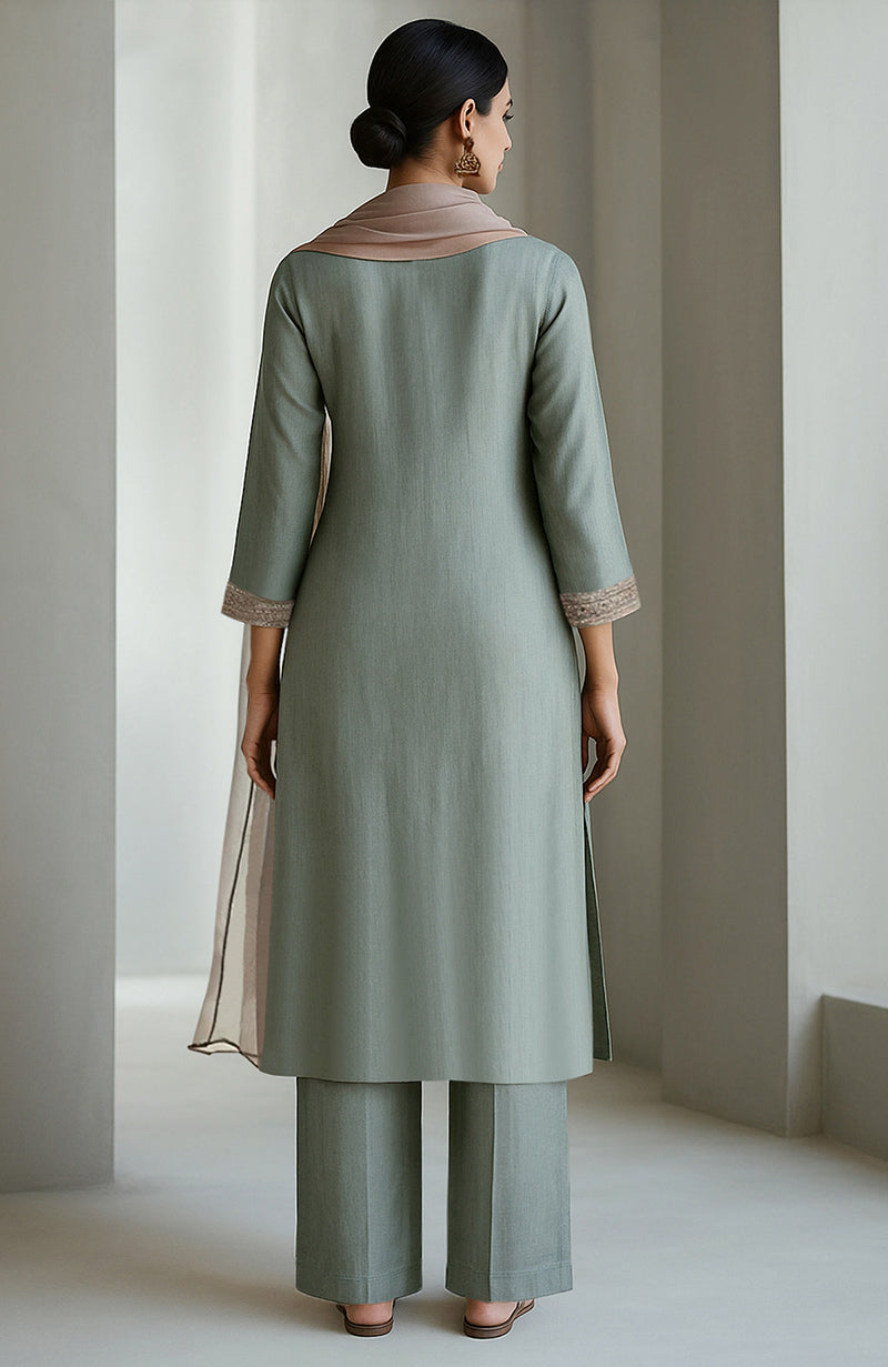 Eucalyptus green kurta set with embroidery, wide-leg trousers, and sheer organza dupatta.