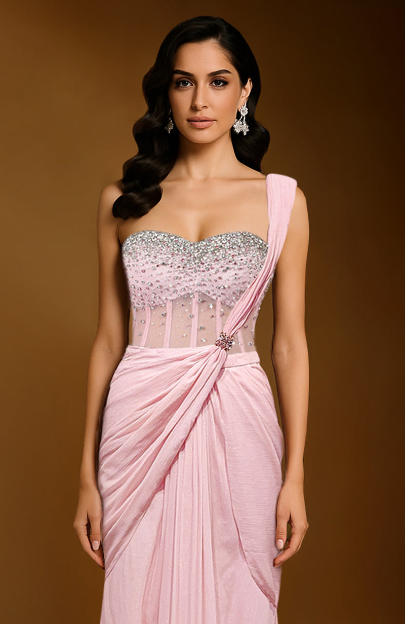 Pink saree with crystal-draped corset blouse and one-shoulder drape with brooch detail