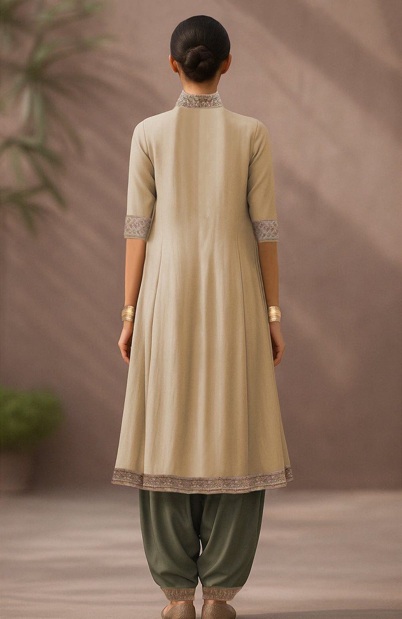 Pale gold A-line kurta with burnished olive salwar and attached embroidered side drapes.