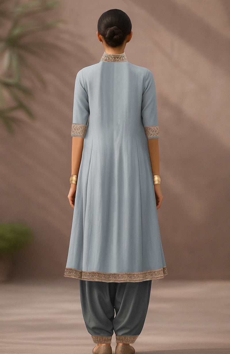 Pearl blue embroidered A-line kurta with attached drape and charcoal tapered salwar.