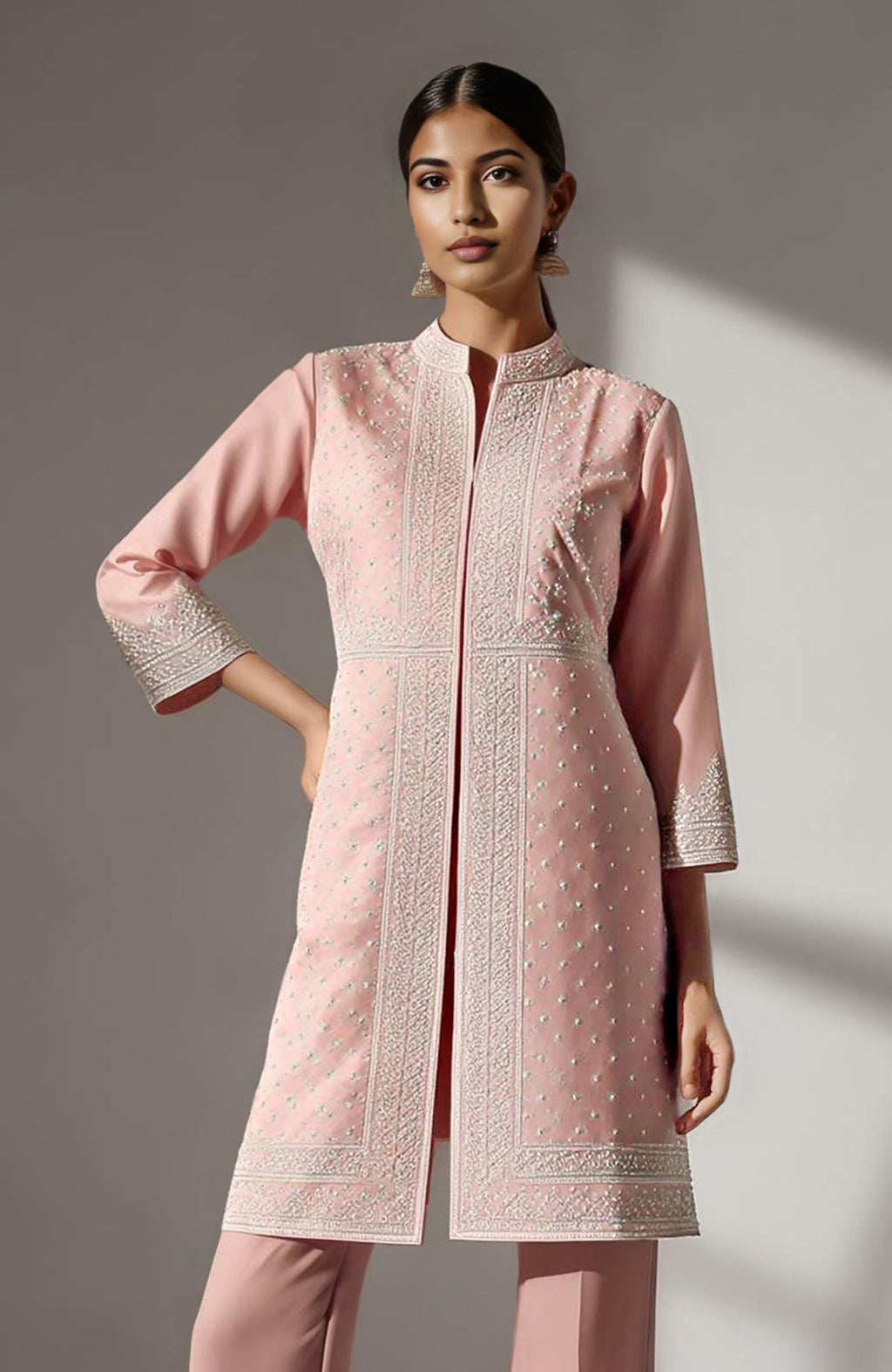 Blush pink straight kurta with ivory chikankari embroidery paired with flared palazzo pants.