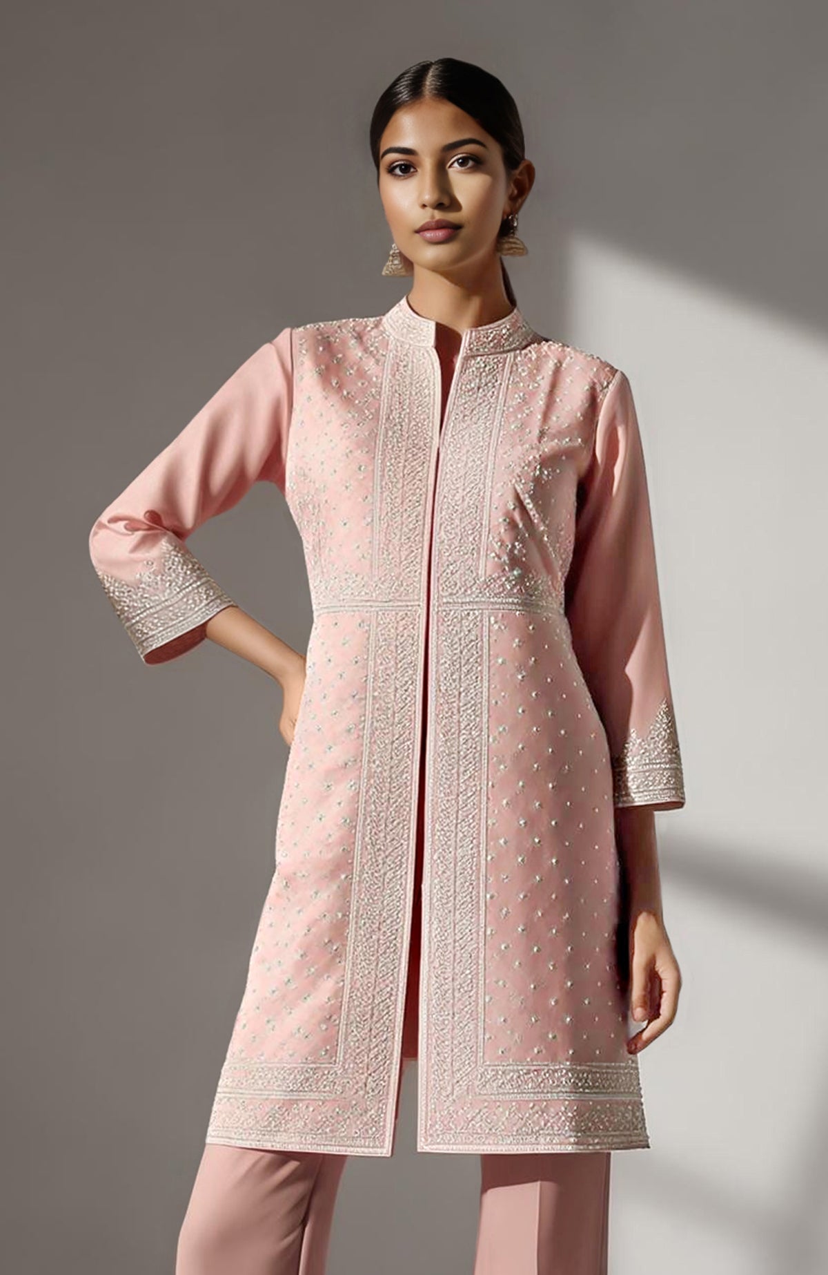 Blush pink straight kurta with ivory chikankari embroidery paired with flared palazzo pants