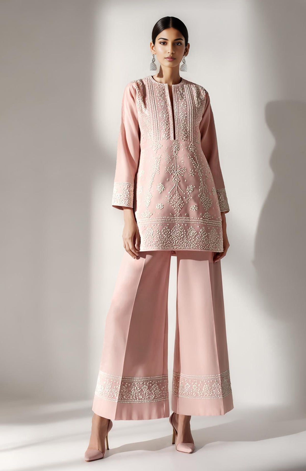 Blush pink short kurta with ivory chikankari embroidery paired with wide palazzo pants