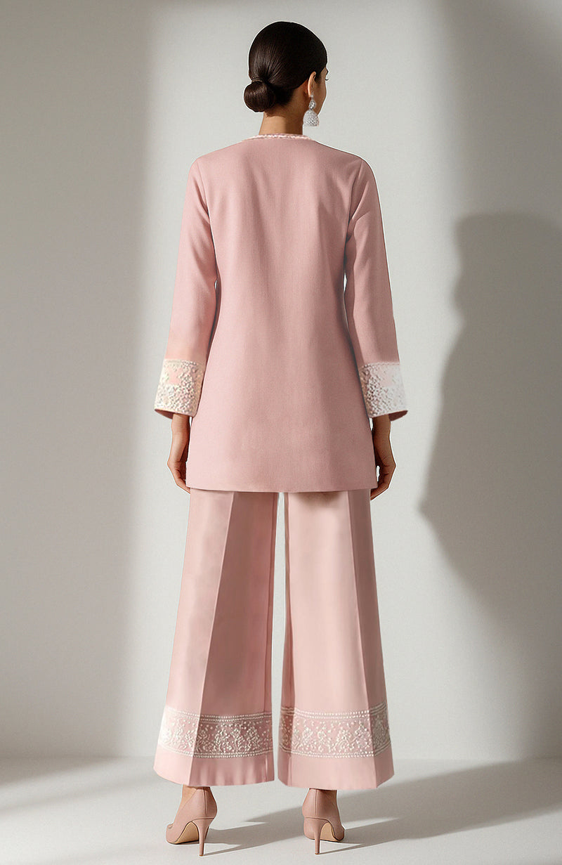 Blush pink short kurta with ivory chikankari embroidery paired with wide palazzo pants