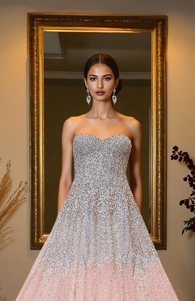 Pink organza princess gown with hand-embroidered crystal and pearl beads on bodice and skirt.