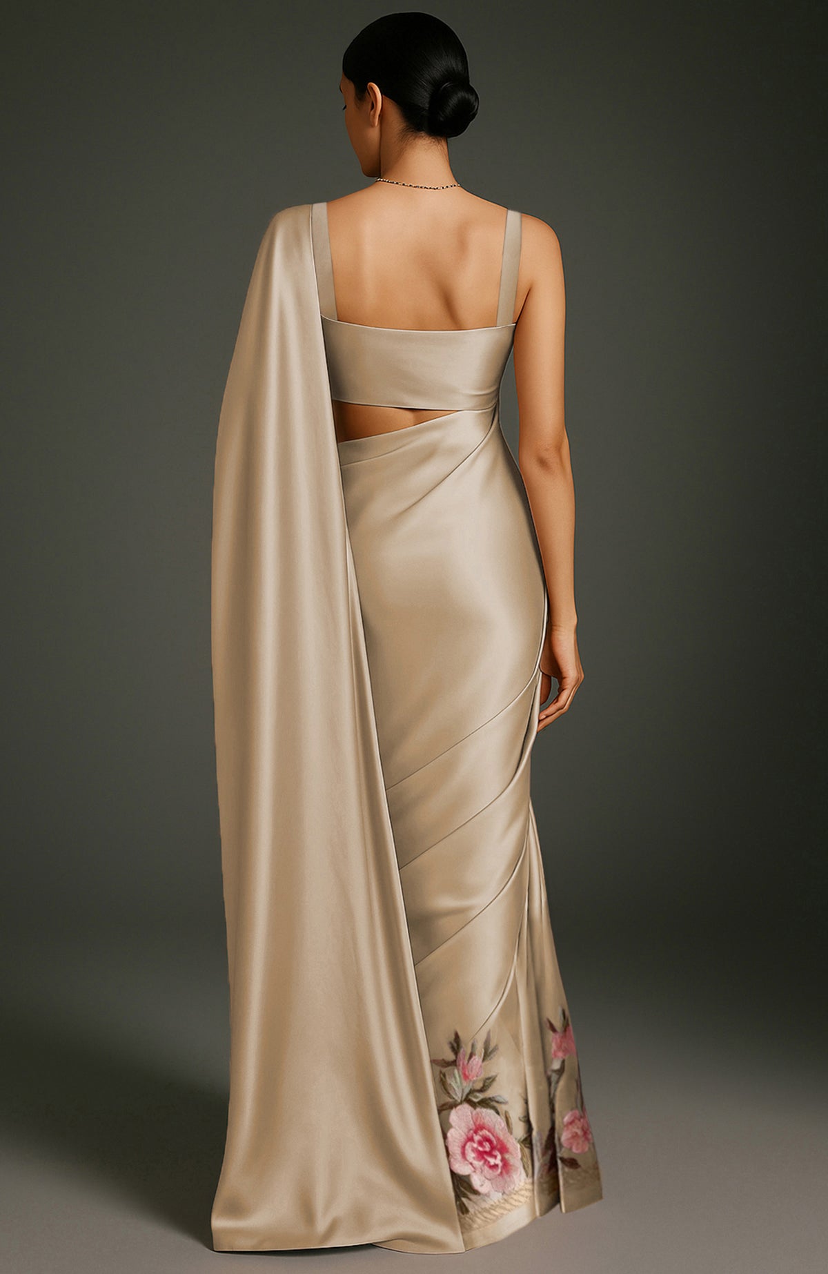 Gold saree with embroidered peonies and roses in pink, burgundy, ivory, and green tones.
