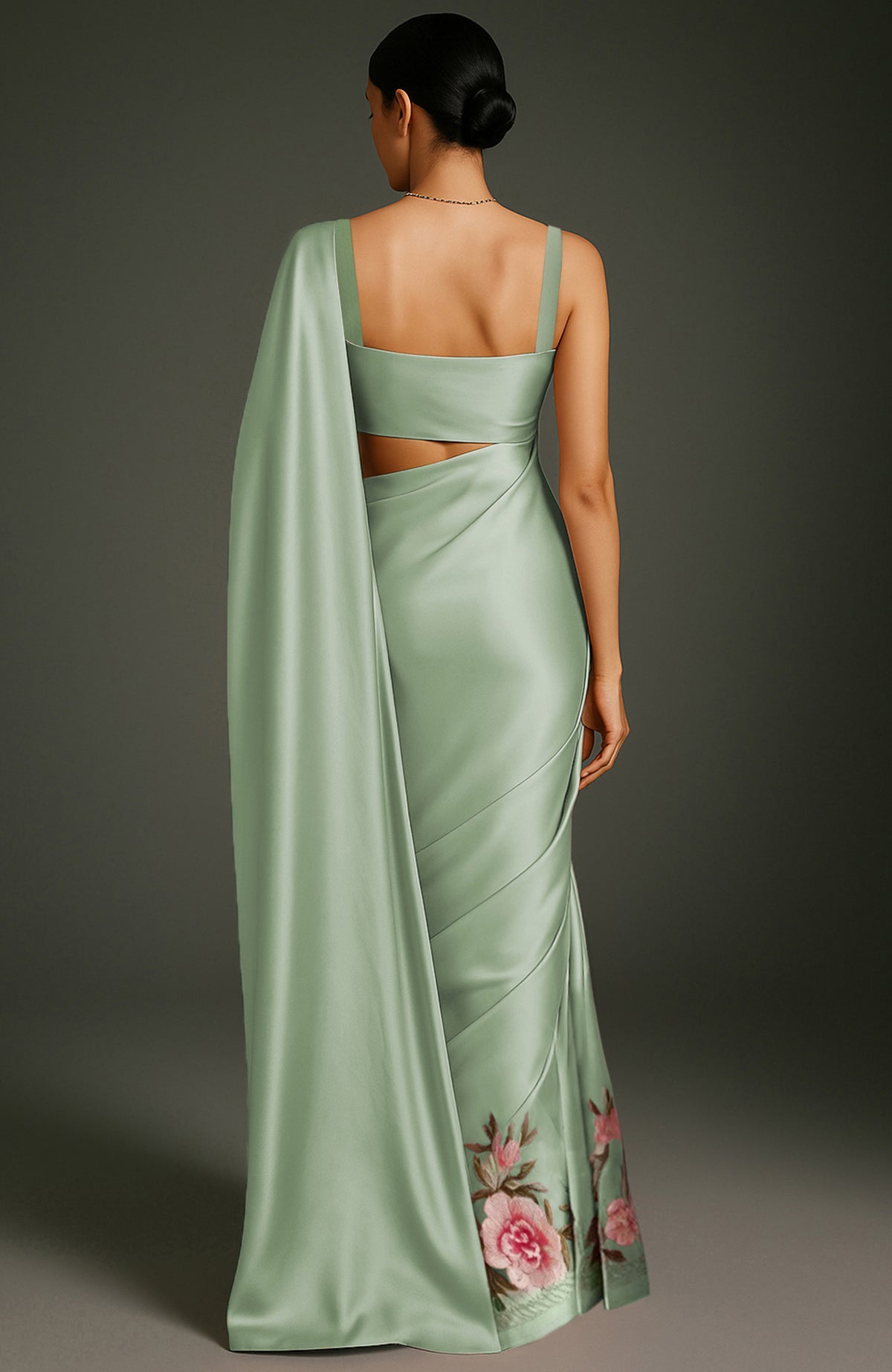 Sage green saree with embroidered peonies and roses in pink, burgundy, ivory, and green tones.