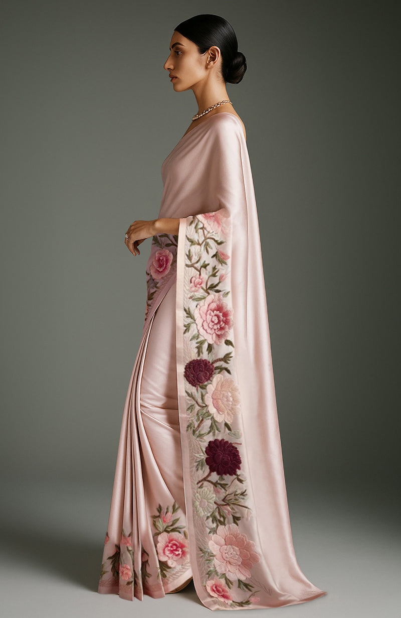 Blush pink saree with embroidered peonies and roses in soft pastel colors and wide floral border
