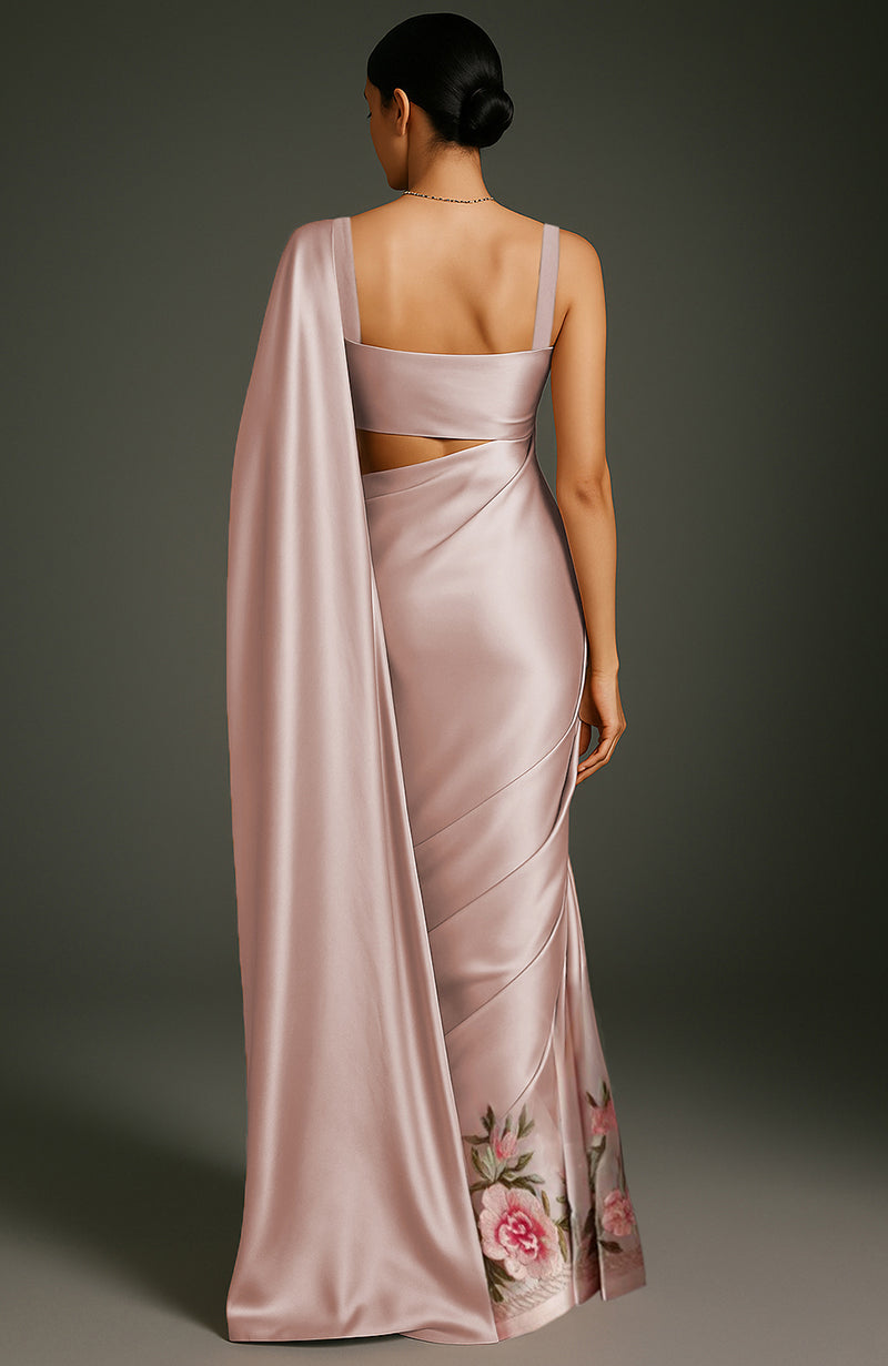 Blush pink saree with embroidered peonies and roses and a sleeveless blouse with gold straps