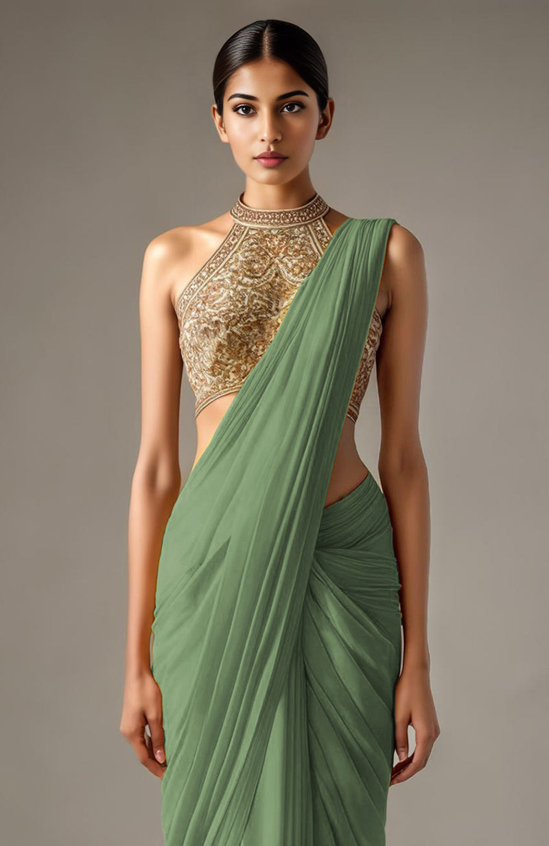 Sage green saree with red and pink floral embroidery paired with a heavily embroidered halter blouse