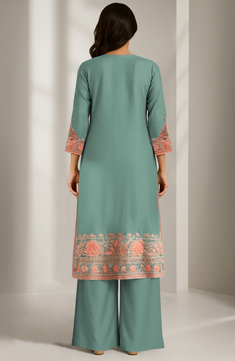Teal green knee-length kurta with peach floral embroidery and matching wide-legged palazzo pants