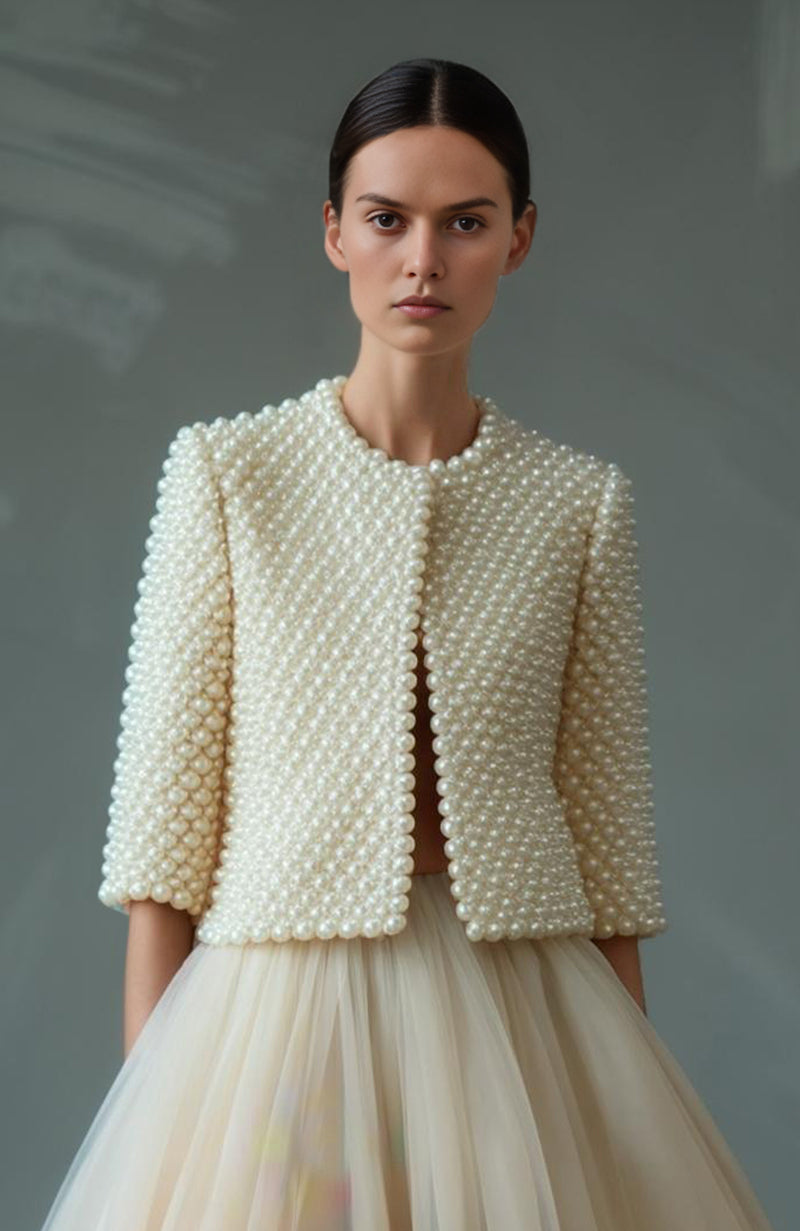 Pearl-embroidered cropped jacket with round neck and floral high-waisted full-length skirt.