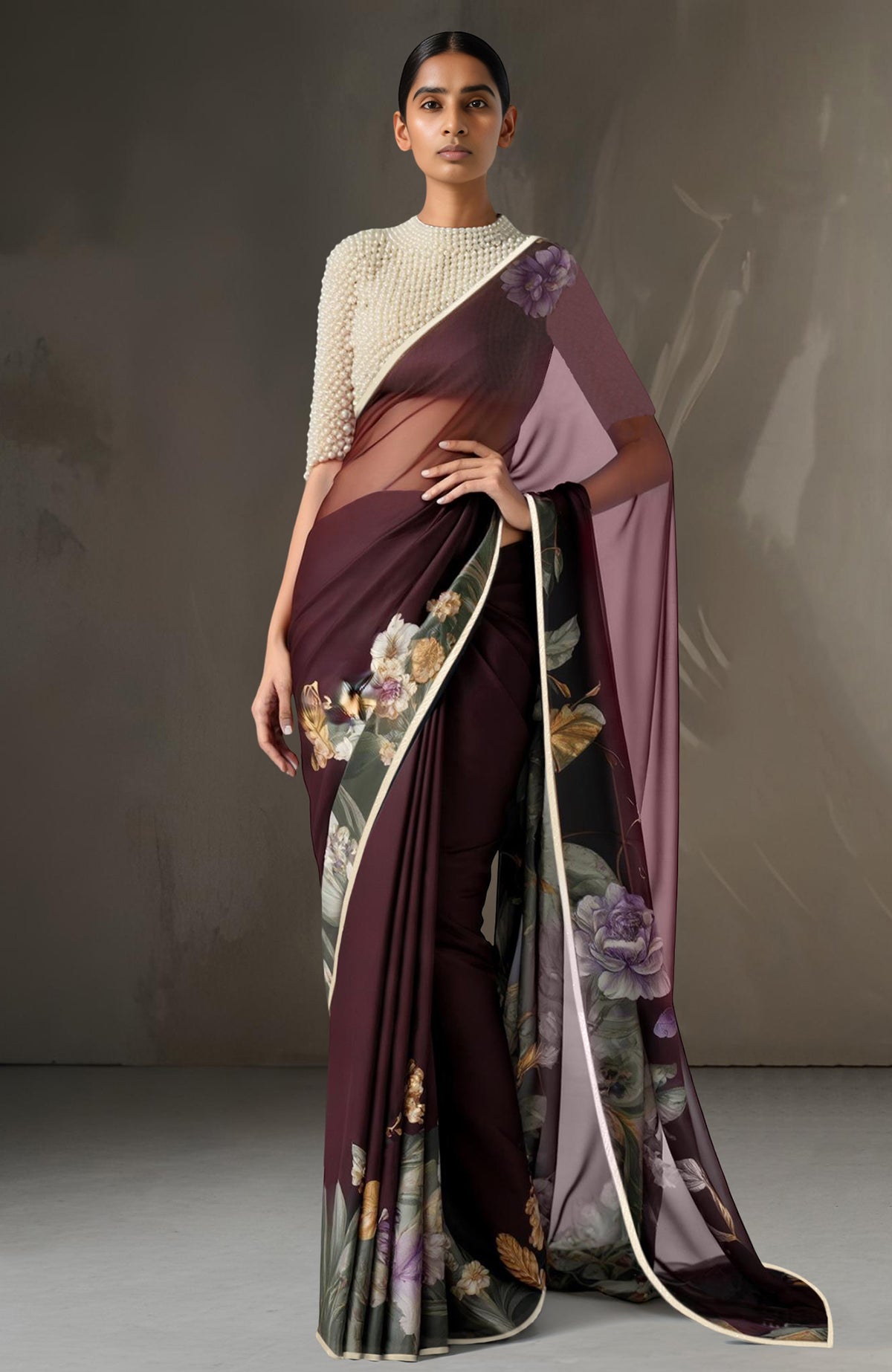 Deep wine chiffon saree with vintage floral prints paired with pearl-embroidered ivory blouse.