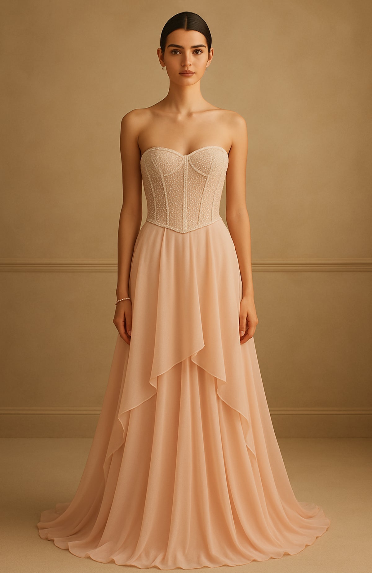 Strapless champagne gown with pearl and bead embroidered corset and flowing tiered skirt