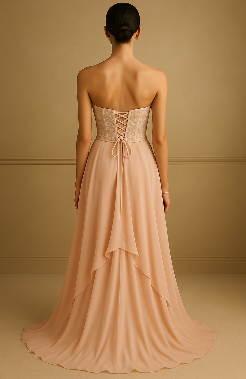 Strapless champagne gown with pearl and bead embroidered corset and flowing A-line skirt