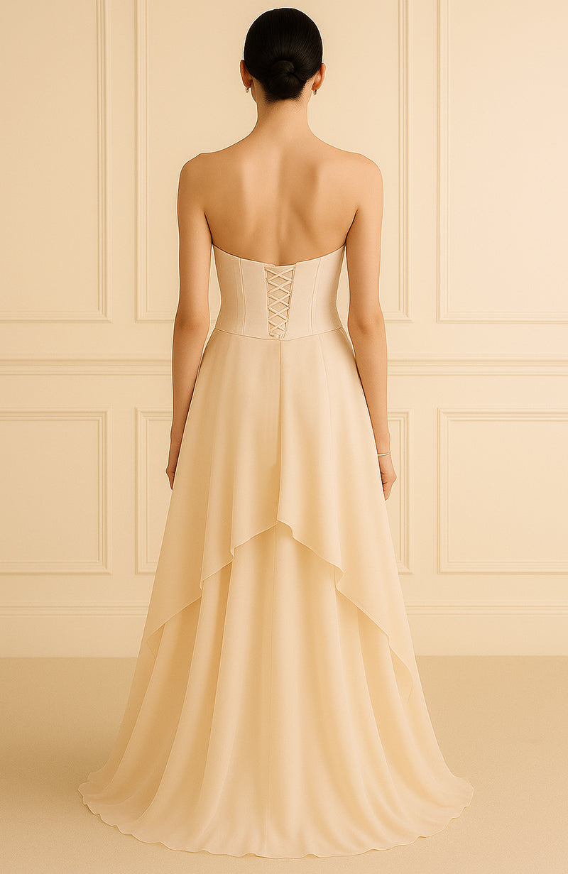 Strapless champagne gown with pearl and bead embroidered corset and flowing A-line skirt