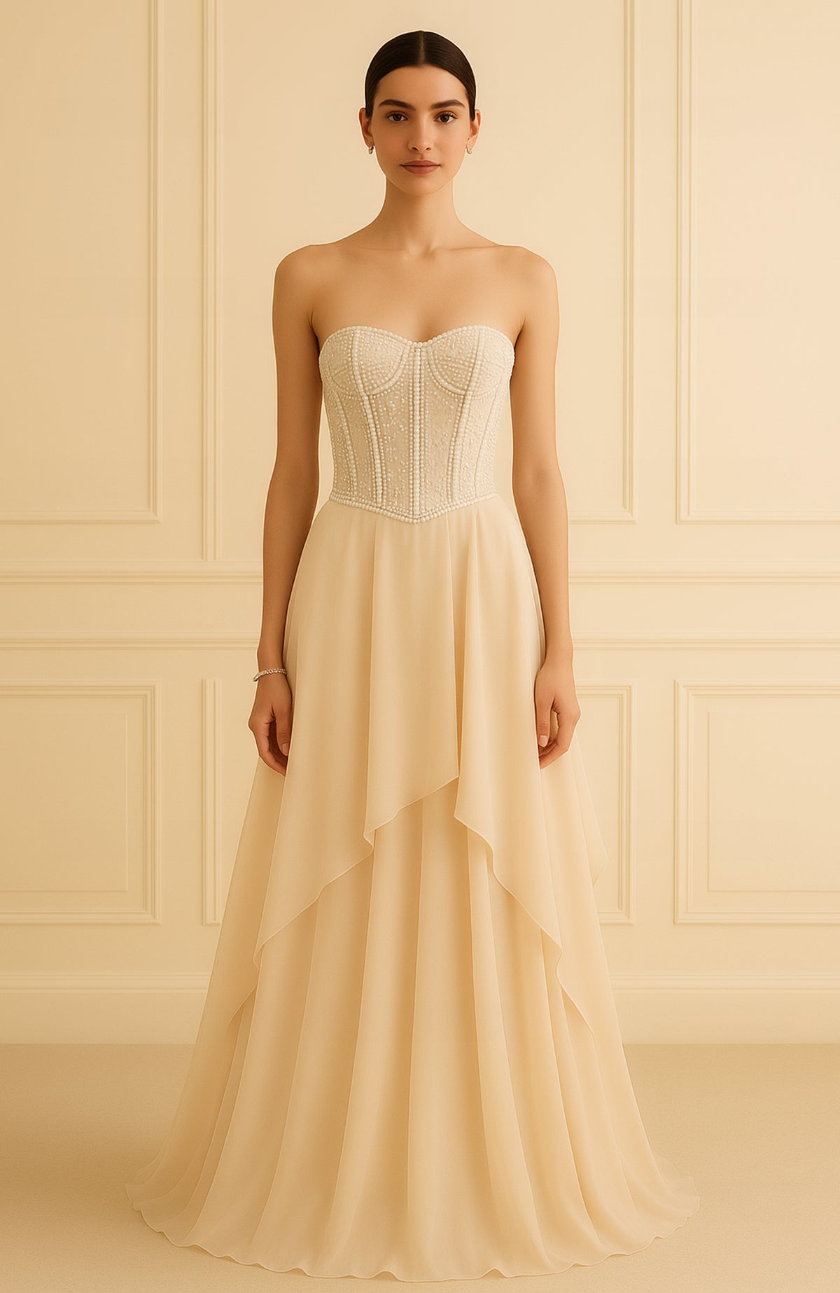 Strapless champagne gown with pearl and bead embroidered corset and flowing A-line skirt