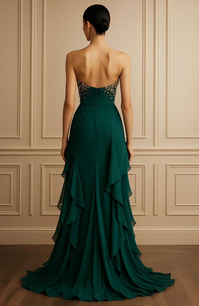 Strapless emerald green gown with gold floral embroidery and layered cascading skirt.