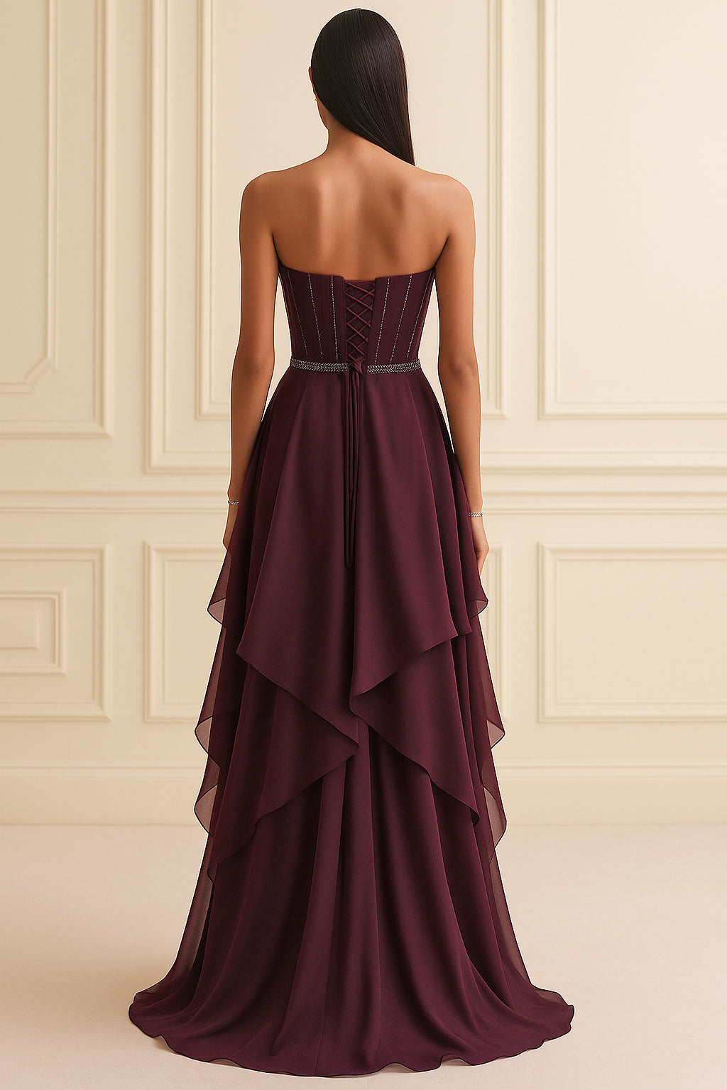 Strapless garnet corset gown with beaded sweetheart neckline and layered georgette skirt.