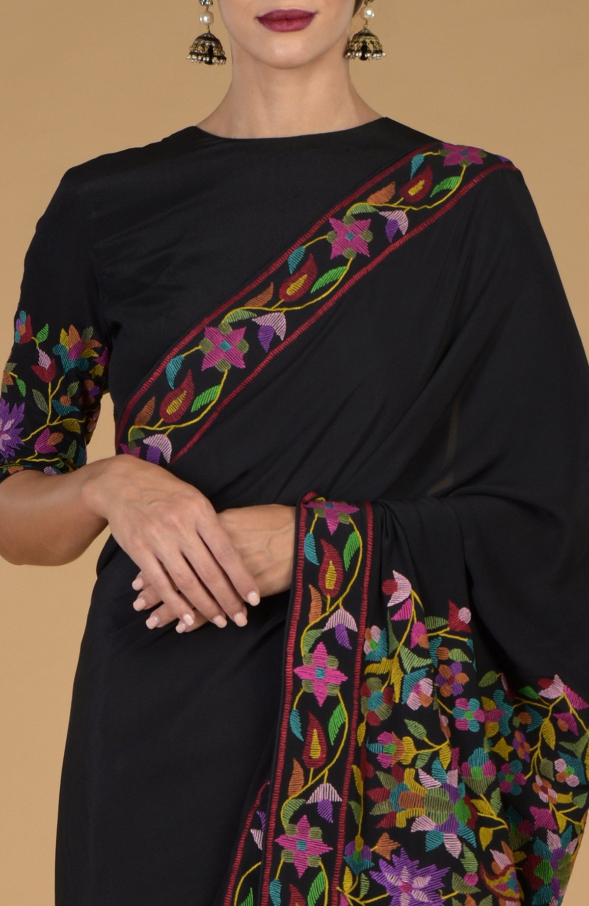 Black pure crepe silk saree with multicolor Kani art floral embroidery.