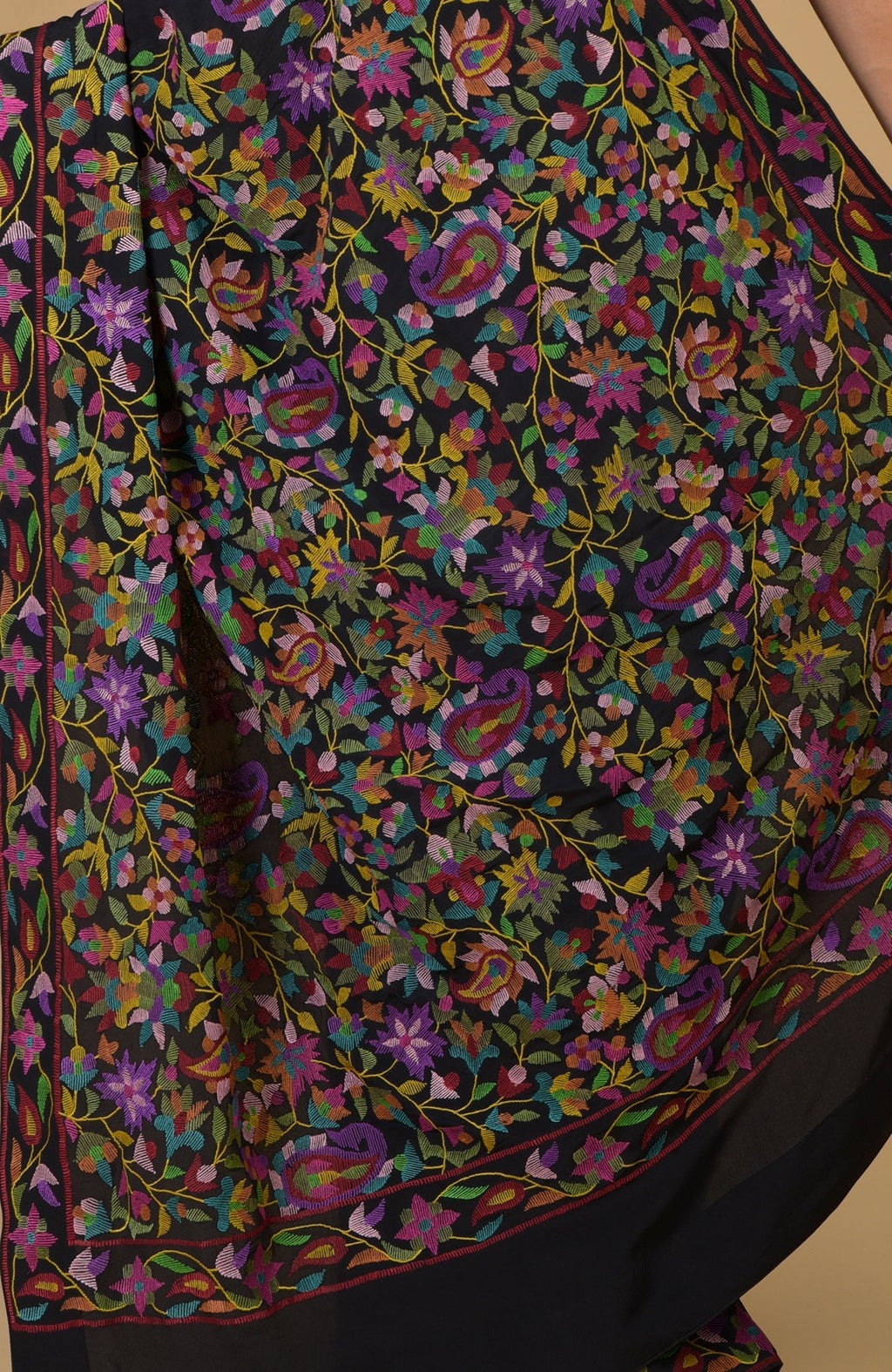 Black pure crepe silk saree with multi-color floral and paisley Kani art embroidery.