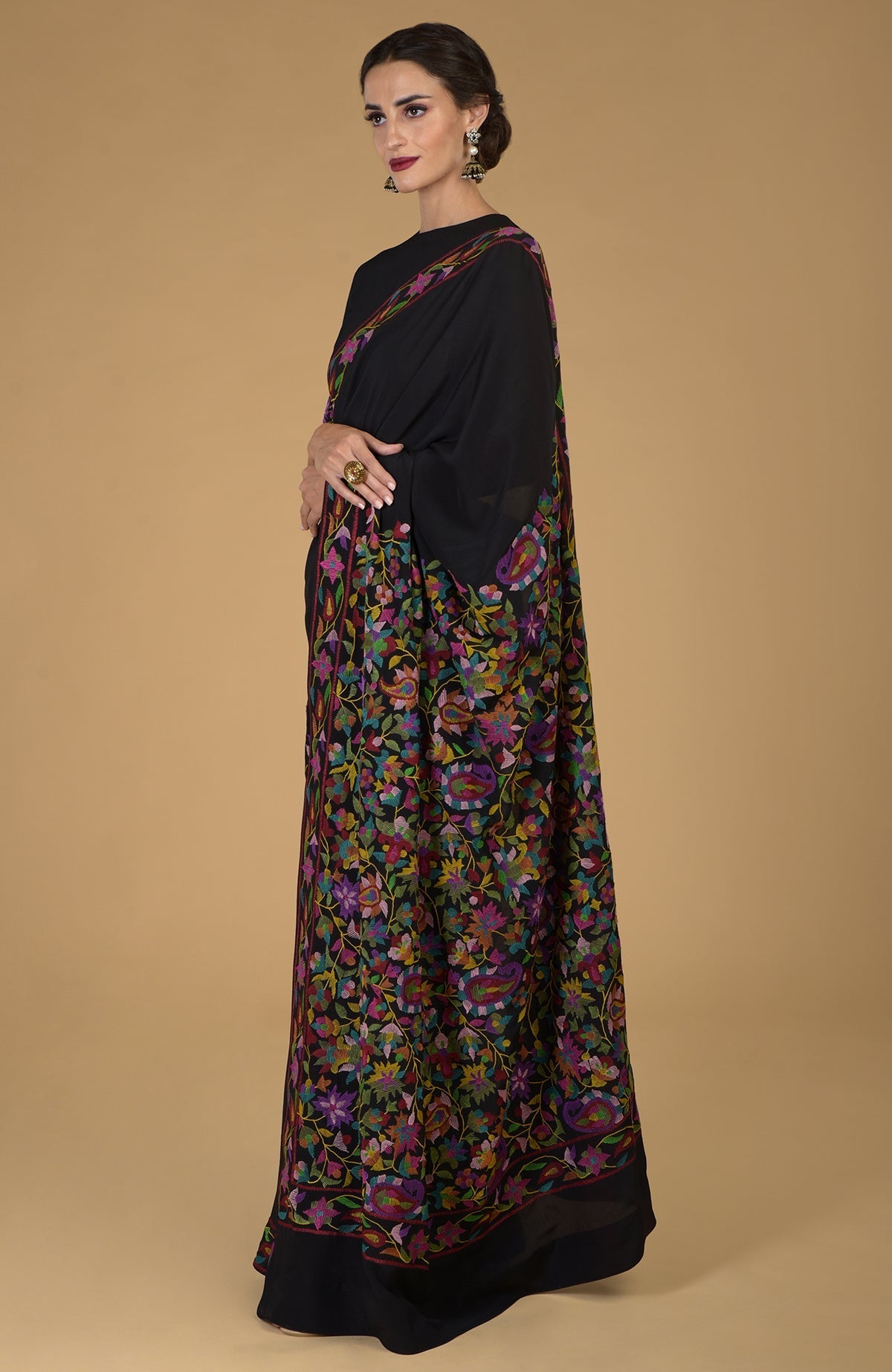 Black pure crepe silk saree with multi-color Kani art floral embroidery.