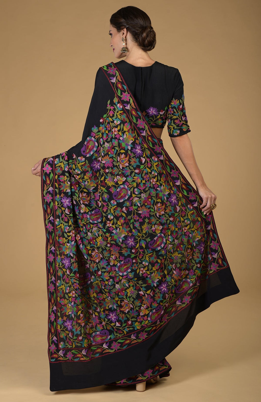 Black pure crepe silk saree with multicolor floral and paisley Kani art embroidery.