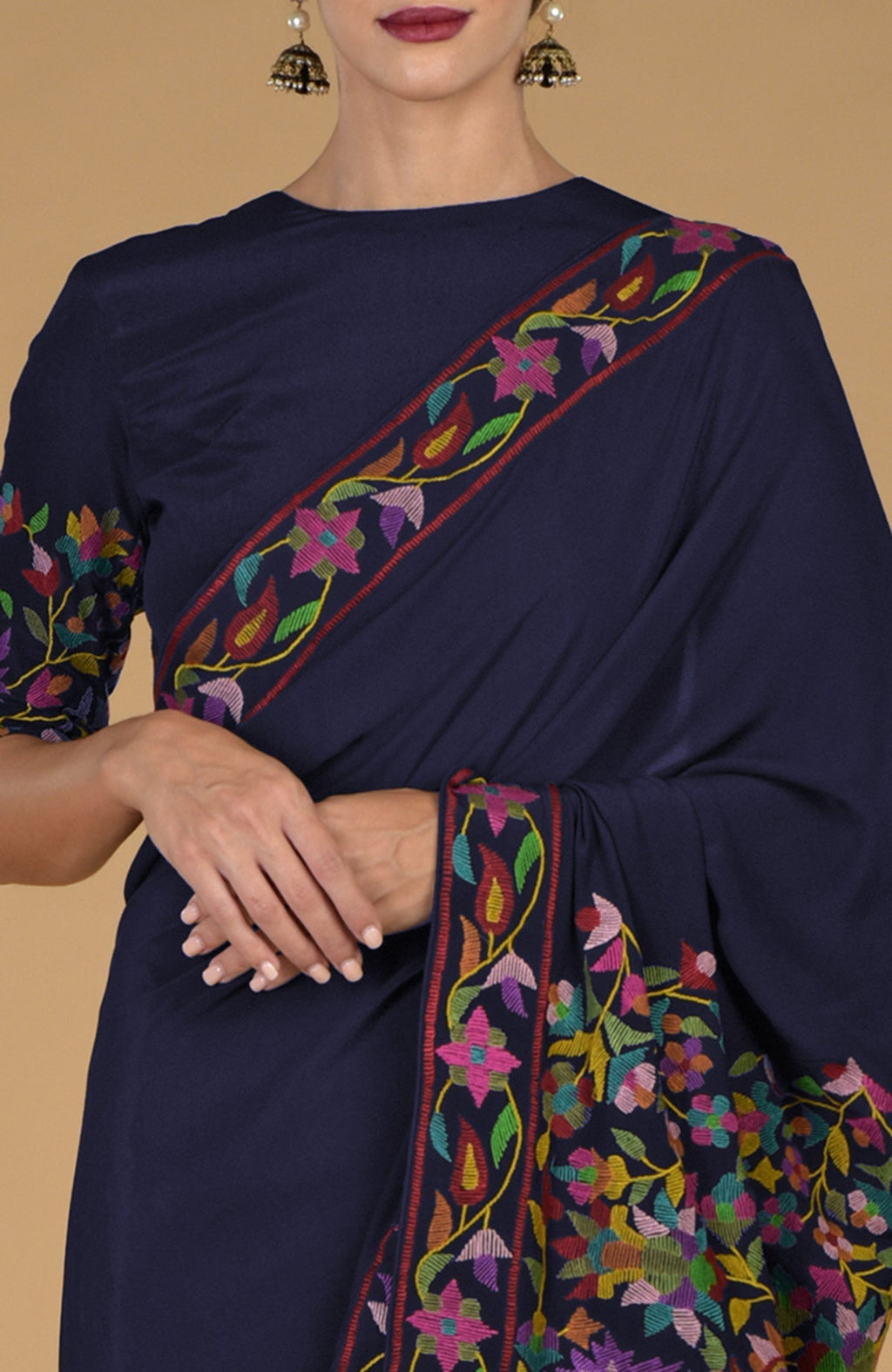 Midnight blue pure crepe silk saree with multicolor Kashmir Kani art floral embroidery.