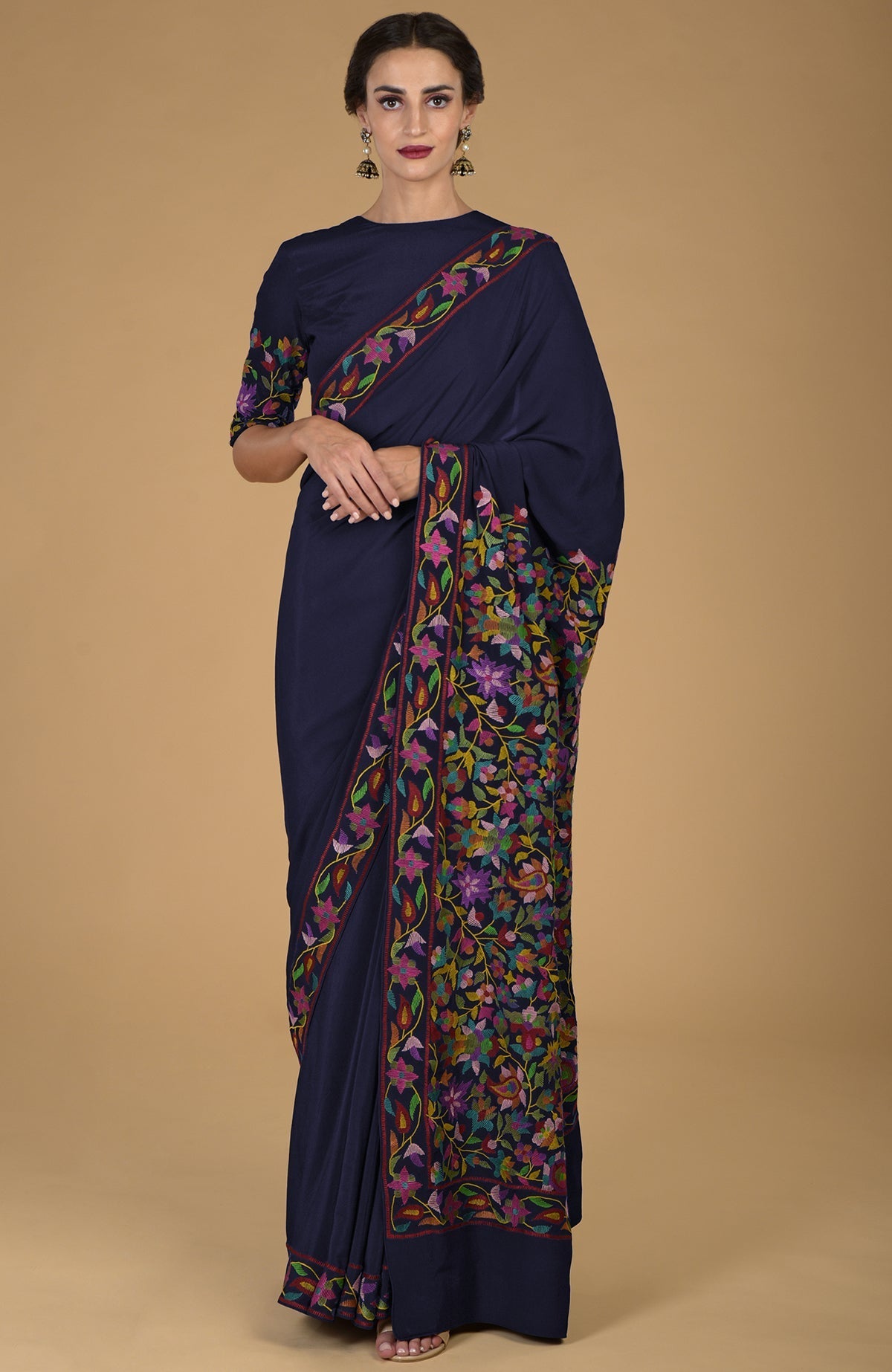 Black pure crepe silk saree with multicolor Kani art floral embroidery.