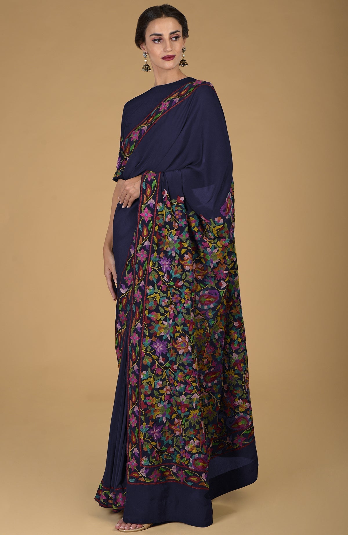Midnight blue pure crepe silk saree with multicolor Kani art floral embroidery.