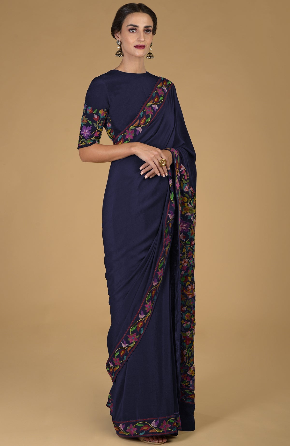 Midnight blue pure crepe silk saree with multicolor floral Kani art embroidery.