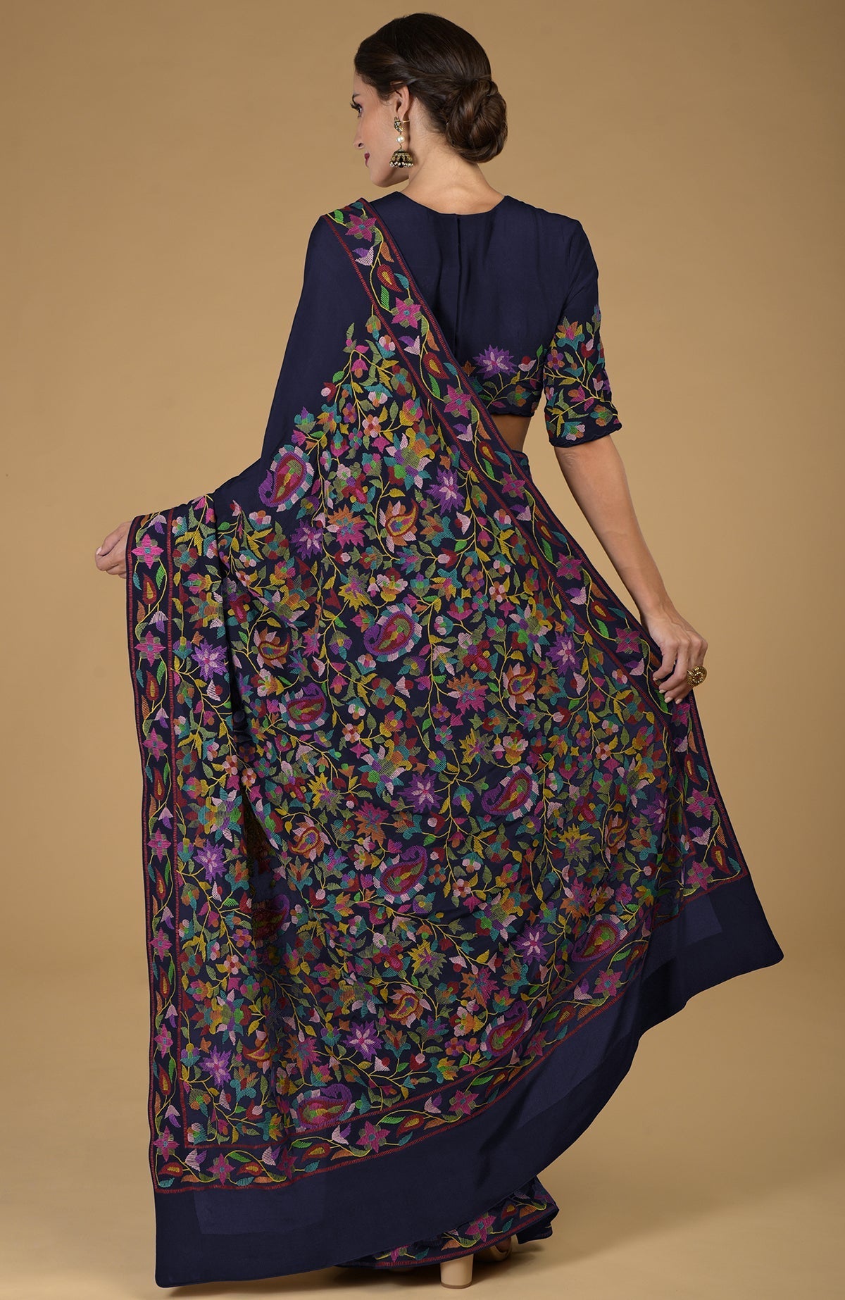 Midnight blue pure crepe silk saree with multicolor Kani art floral embroidery.