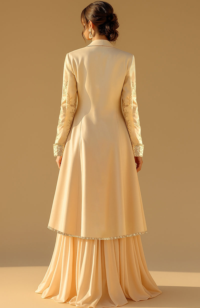 Golden nude three-piece set with embroidered jacket, bustier blouse, and pleated lehenga skirt.
