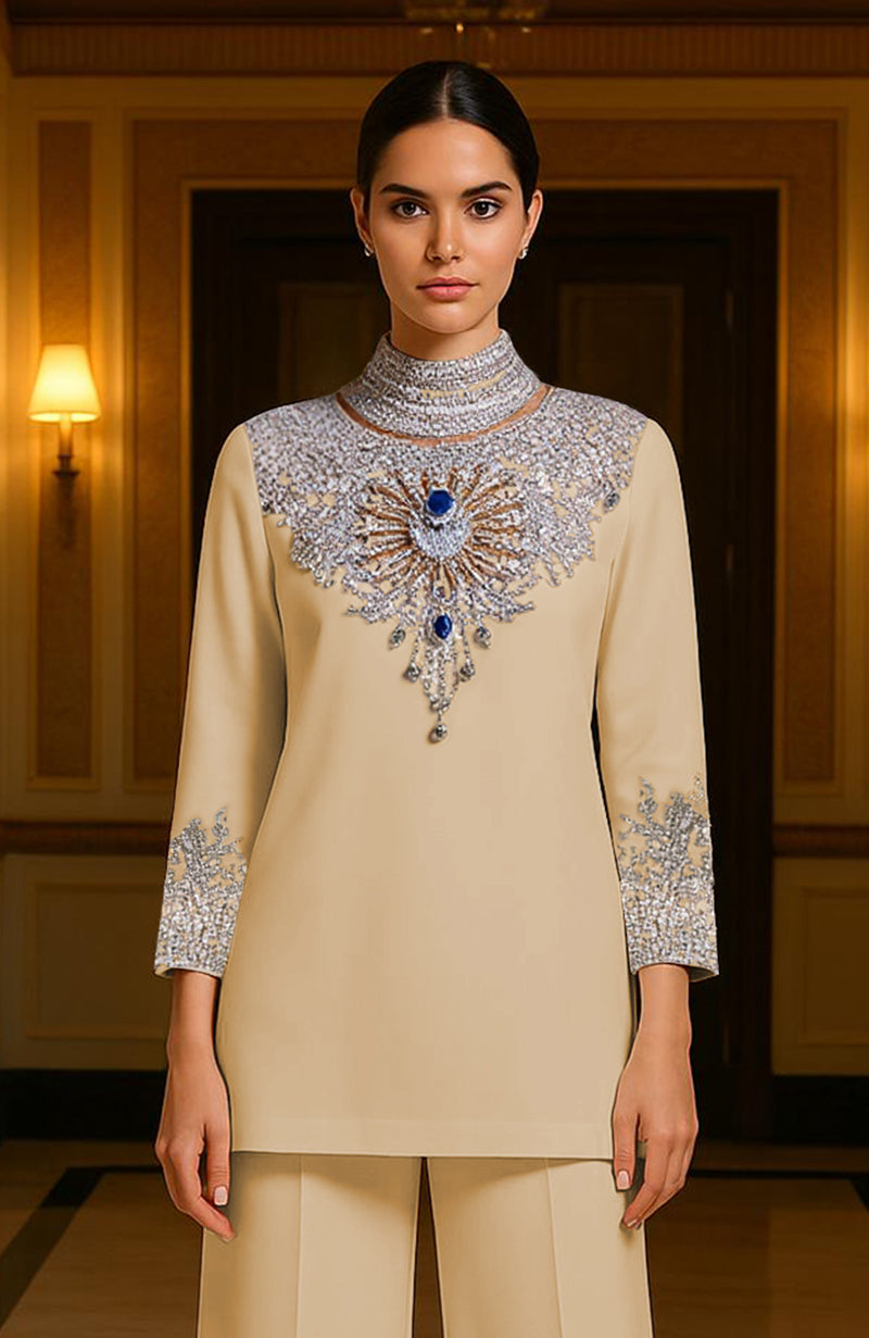 Champagne Royale two-piece with crystal embroidery, silver beads, gold accents, and sapphire stones.