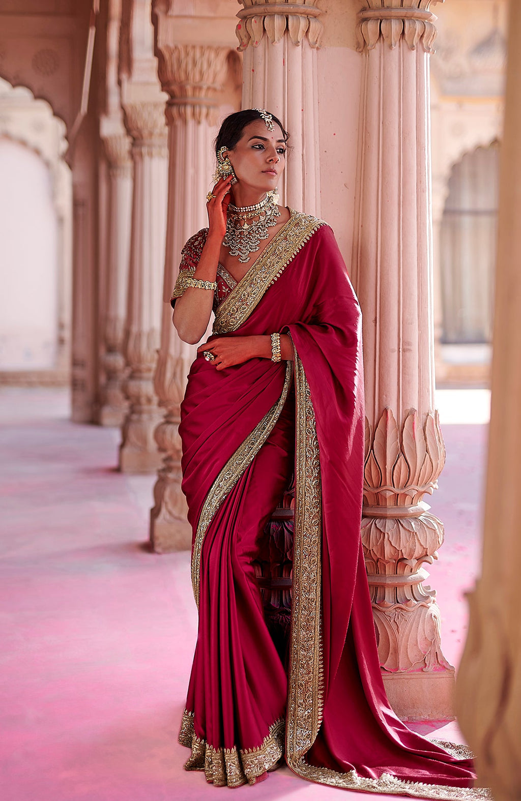 Blood red pure silk saree with gold zardozi embroidery and embellished blouse in Nivi drape style
